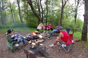 Friends around campfire